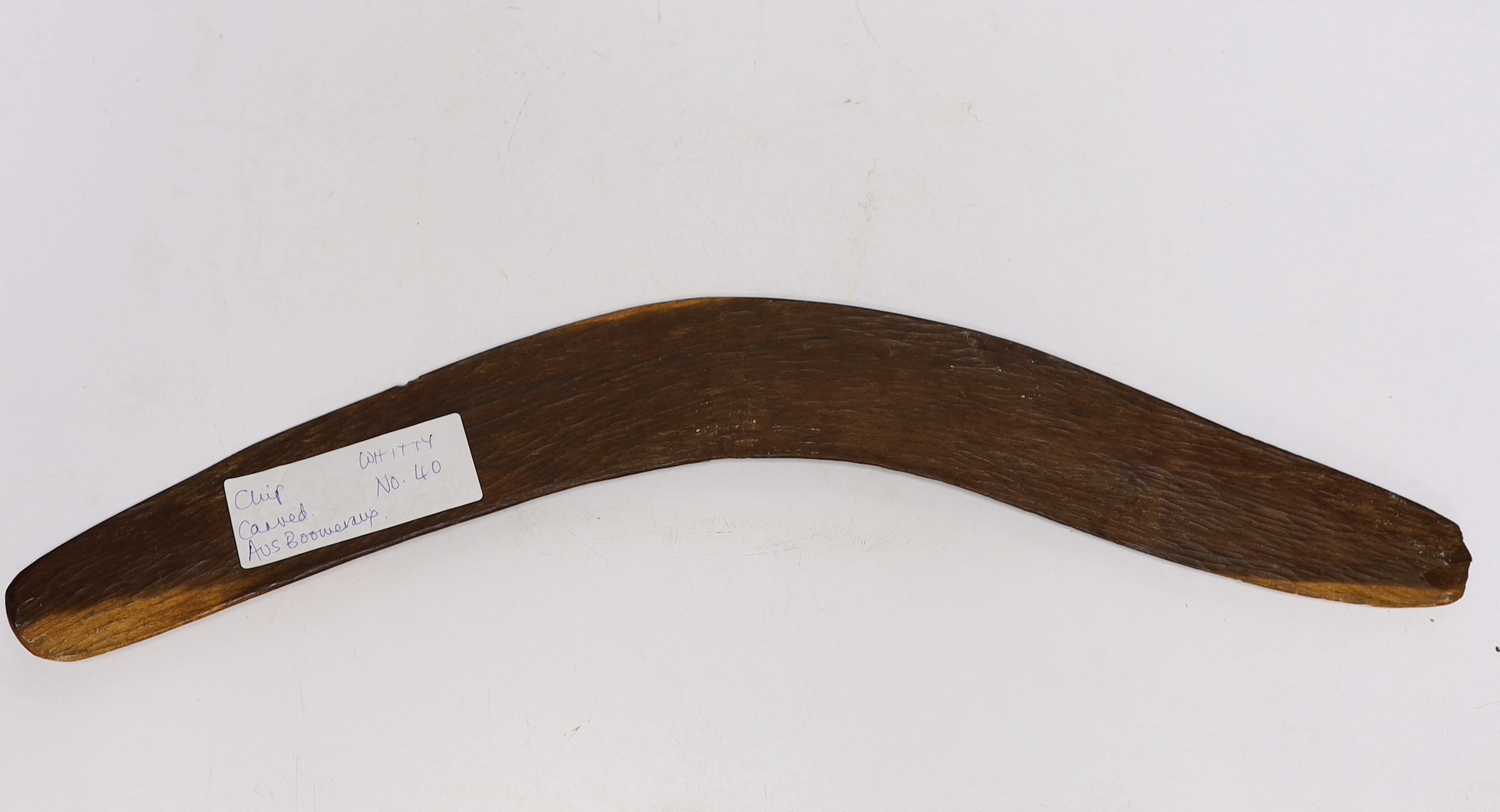 A chip carved Australian boomerang, 53cm in length